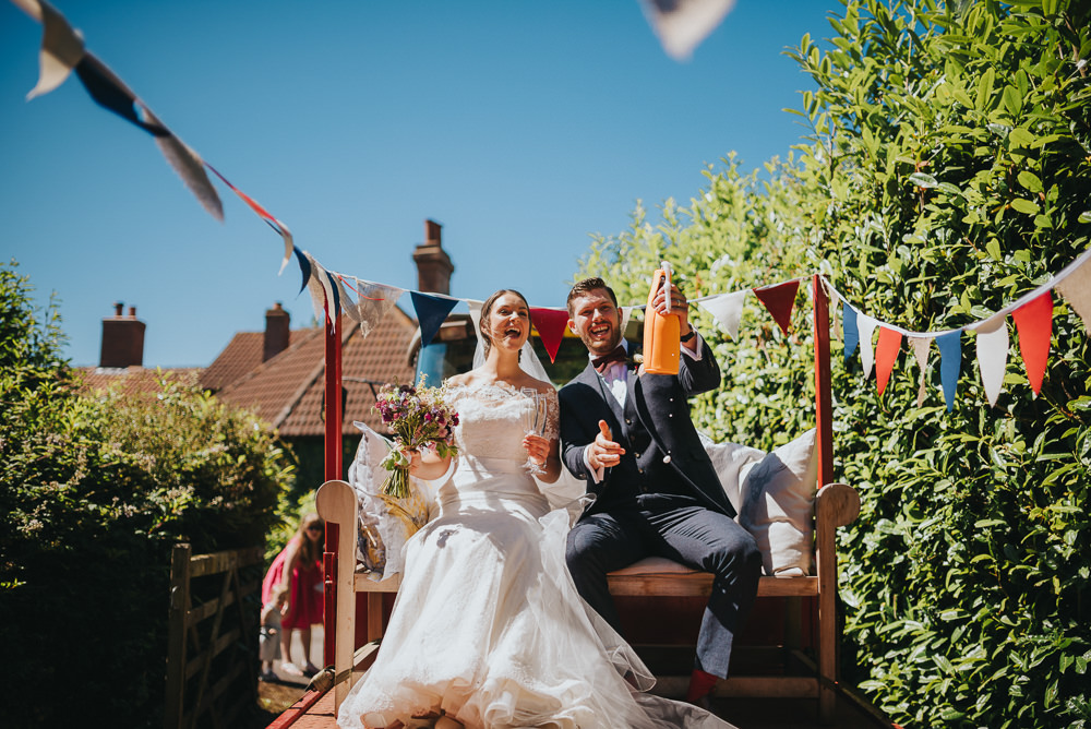 Bride Bridal Dress Gown Sweetheart Bolero Off Shoulder Lace Navy Suit Groom Burgundy Oxblood Bow Tie Tractor Bunting Kittisford Barton Wedding Joab Smith Photography