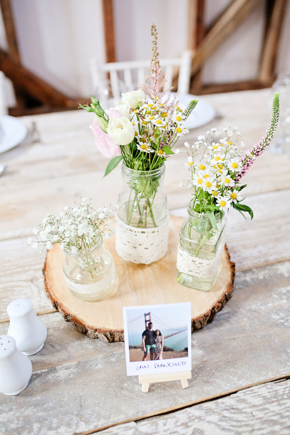 Table Centrepiece Decor Log Slice Flowers Jars Lace Milling Barn Wedding Victoria Mitchell Photography