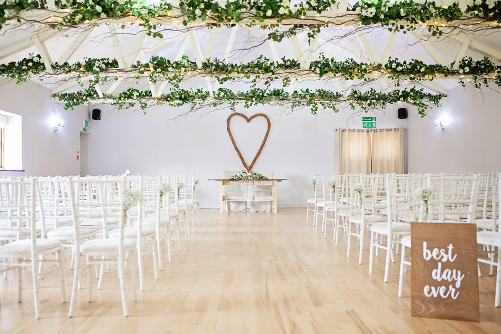 Ceremony Aisle Wooden Chairs Greenery Foliage Wicker Heart Milling Barn Wedding Victoria Mitchell Photography