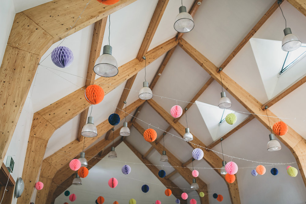 Lanterns Decor Colourful Rock Village Hall Wedding Lucie Hamilton Photography