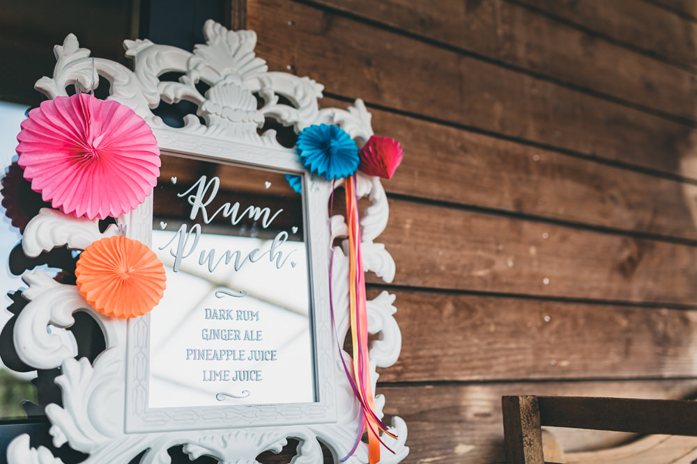 Colourful Pinwheels Mirror Calligraphy Sign Drinks Bar Rock Village Hall Wedding Lucie Hamilton Photography