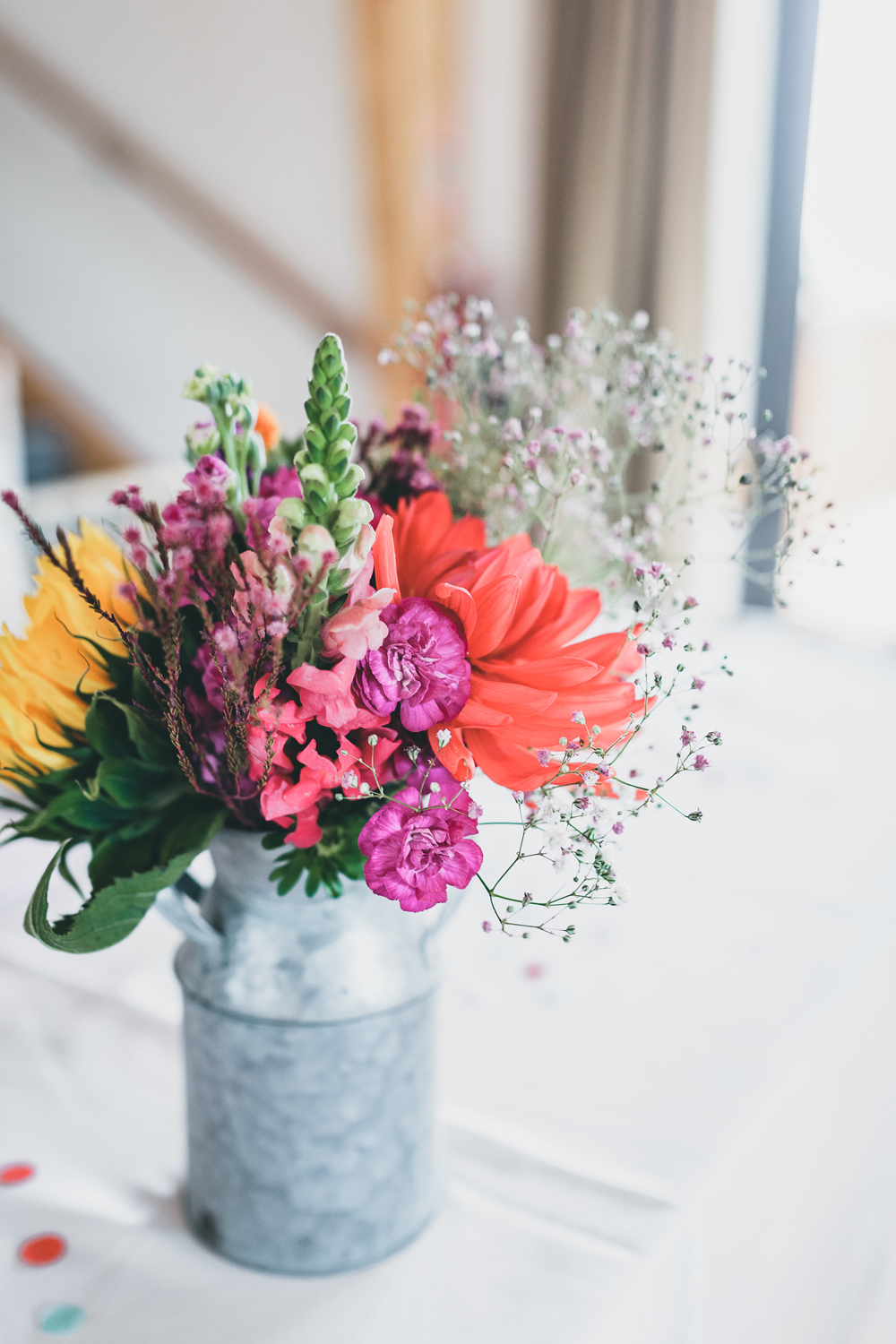 Milk Churn Table Flowers Centrepiece Colourful Decor Rock Village Hall Wedding Lucie Hamilton Photography