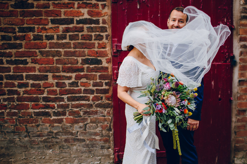 Bride Bridal V Neck Sleeves Beaded Detail Dress Gown Blue Suit Groom Veil Tropical Bouquet Tatton Wedding Stock Farm Barn Amy B Photography