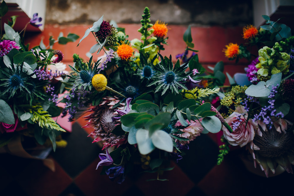 Multicoloured Flowers Sea Holly Orange Eucalyptus Tatton Wedding Stock Farm Barn Amy B Photography