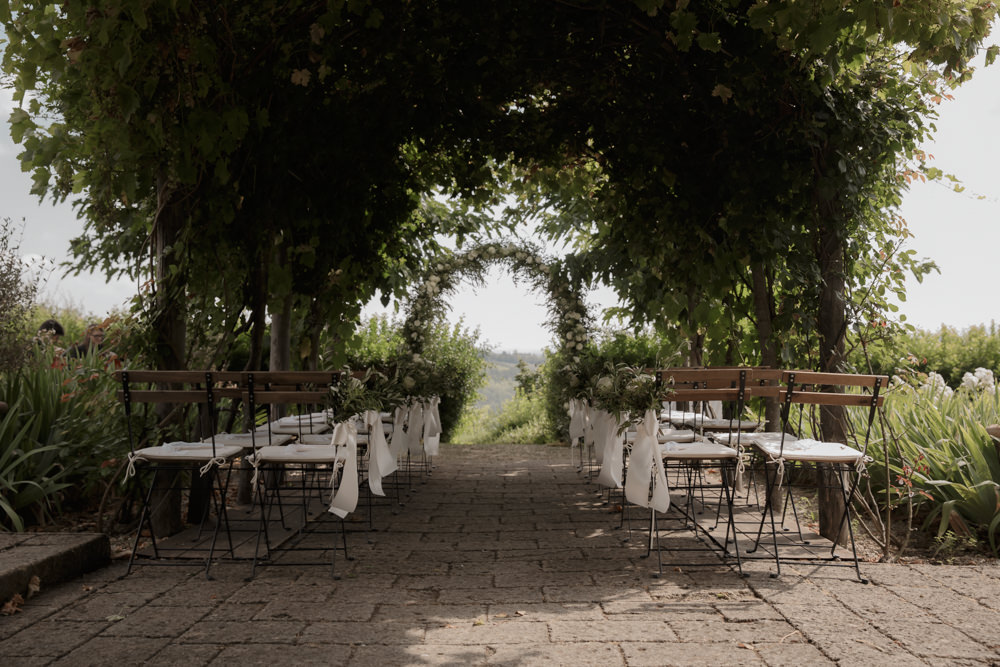 Ceremony Outdoors Backdrop Flowers Arch Floral Greenery Foliage Tuscany Destination Wedding ZONZO