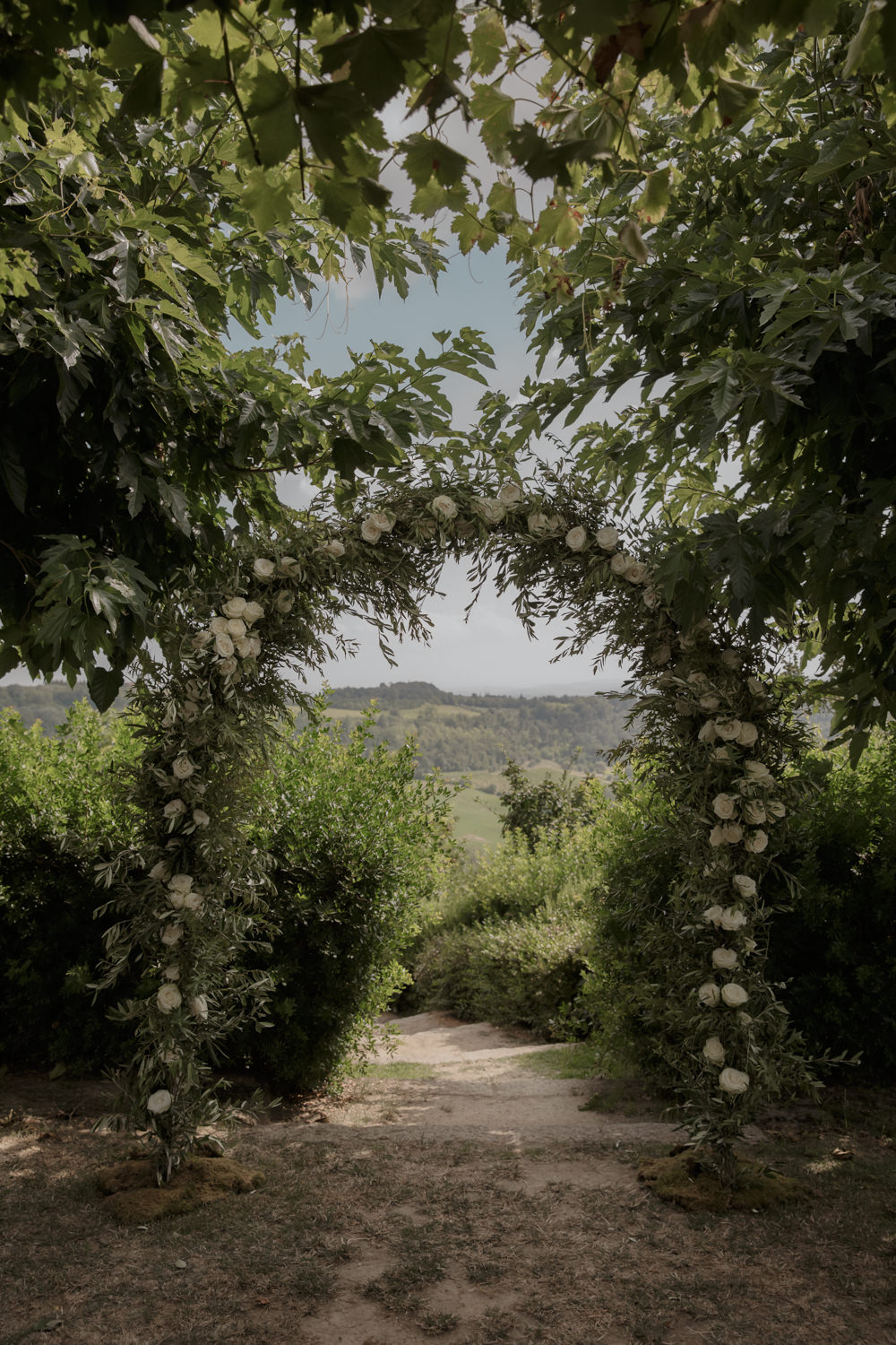 Ceremony Outdoors Backdrop Flowers Arch Floral Greenery Foliage Tuscany Destination Wedding ZONZO
