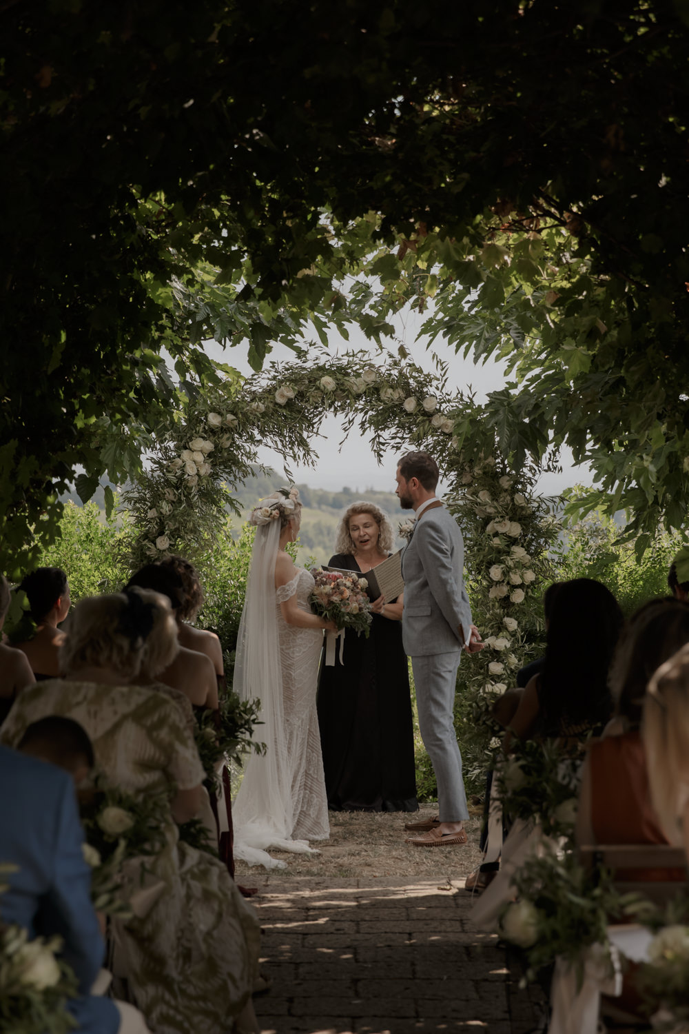Ceremony Outdoors Backdrop Flowers Arch Floral Greenery Foliage Tuscany Destination Wedding ZONZO