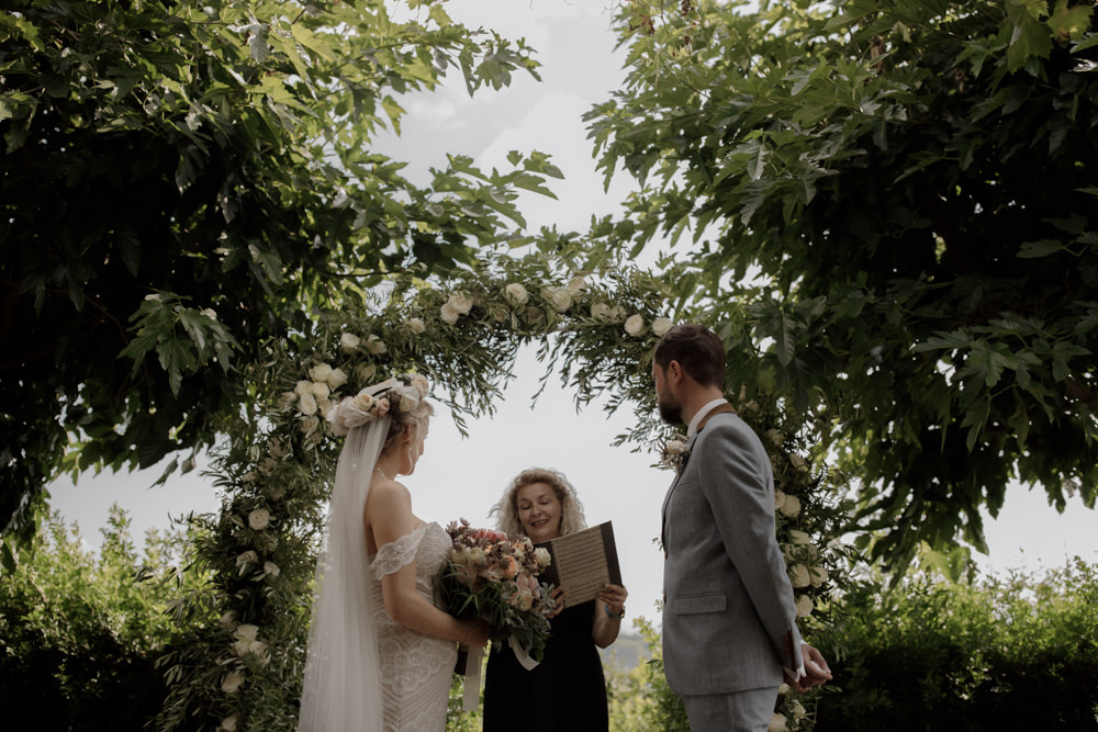 Ceremony Outdoors Backdrop Flowers Arch Floral Greenery Foliage Tuscany Destination Wedding ZONZO