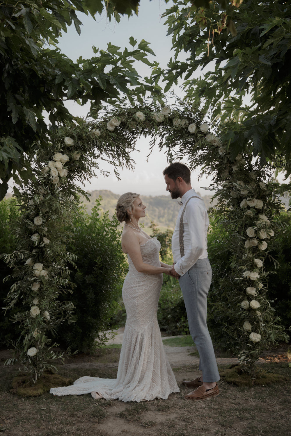 Ceremony Outdoors Backdrop Flowers Arch Floral Greenery Foliage Tuscany Destination Wedding ZONZO