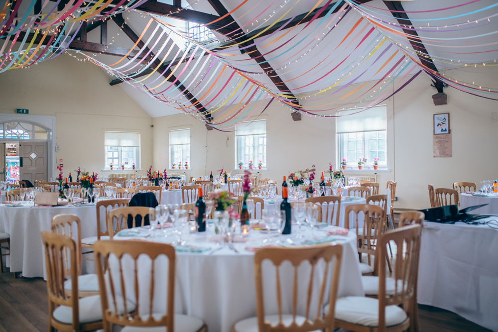 Ribbons Streamers Decor Colourful Ceiling Fairy Lights Village Hall Wedding Samantha Kay Photography