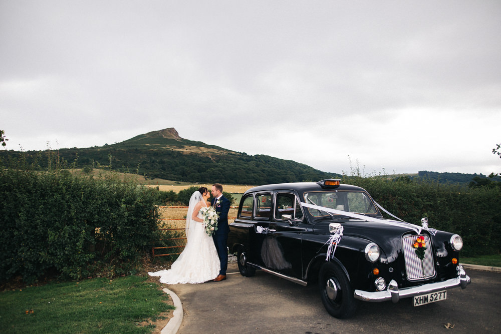 Black Cab Taxi Transport Bride Bridal Sweetheart Neckline Dress Gown Fit Flare Navy Suit Groom Tweed Waistcoat Veil Whinstone View Wedding Sally T Photography