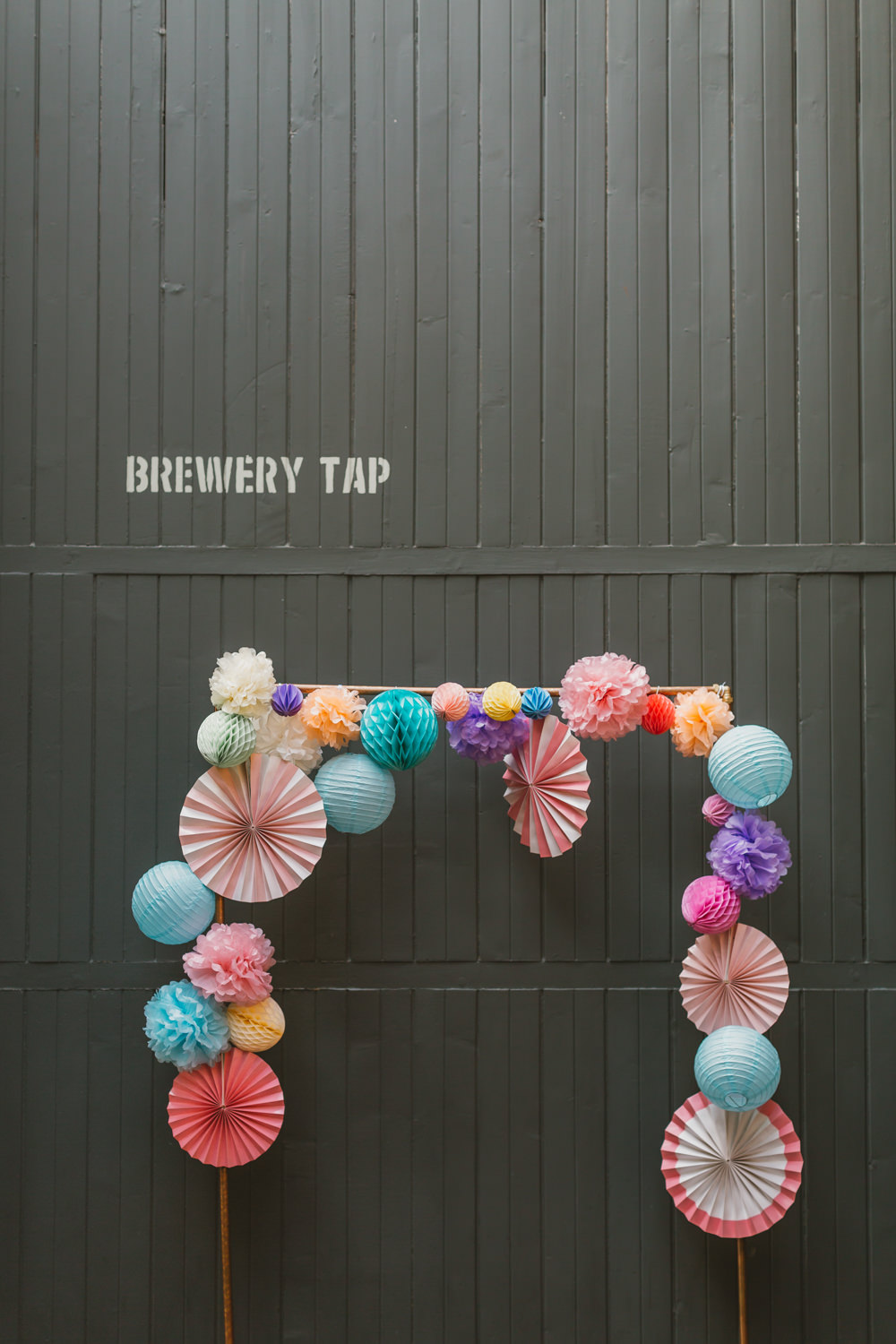 Backdrop Arch Photobooth Colourful Pom Poms Pinwheels Wylam Brewery Wedding Amy Lou Photography