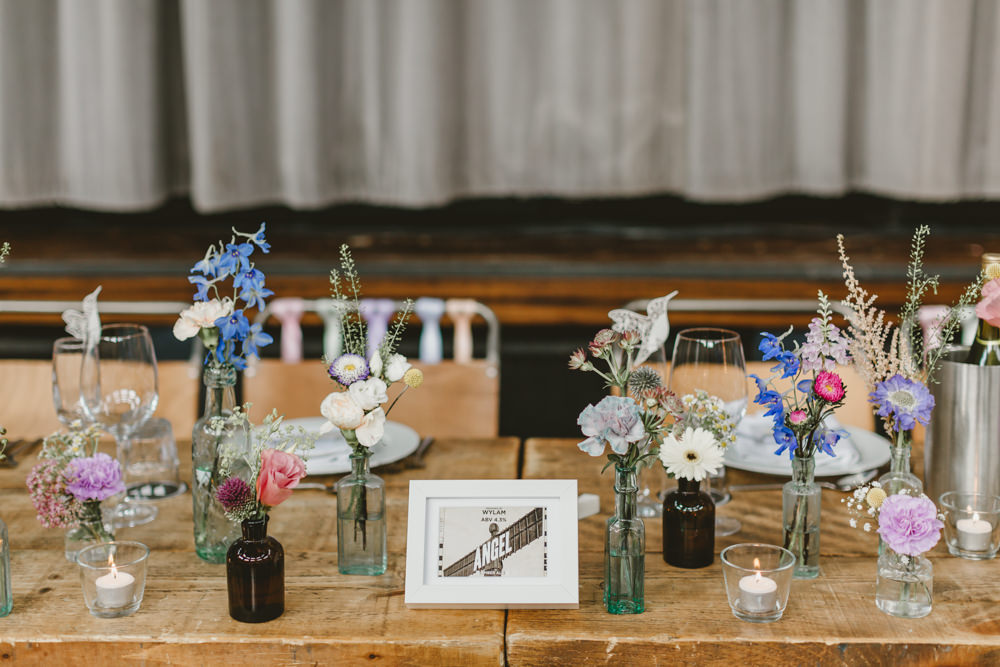 Table Flowers Decor Bottles Colourful Wildflowers Pretty Wylam Brewery Wedding Amy Lou Photography