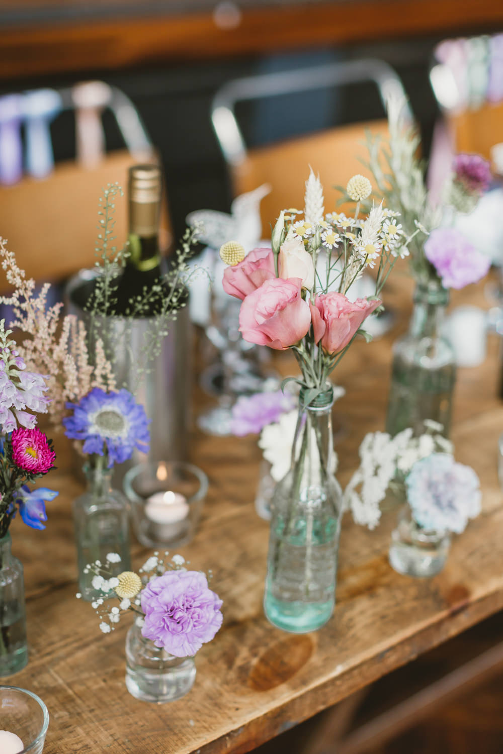Table Flowers Decor Bottles Colourful Wildflowers Pretty Wylam Brewery Wedding Amy Lou Photography