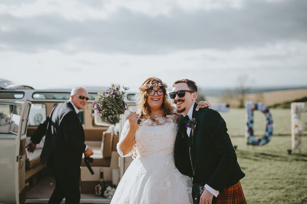 Bride Bridal Lace Sleeves Overlay A Line Dress Gown Flower Crown Kilt Green Jacket Groom Bow Tie VW Campervan Ash Farm Barns Wedding Flawless Photography