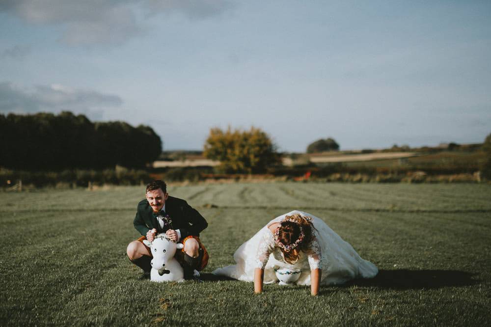 Bride Bridal Lace Sleeves Overlay A Line Dress Gown Flower Crown Kilt Green Jacket Groom Bow Tie Space Hoppers Ash Farm Barns Wedding Flawless Photography