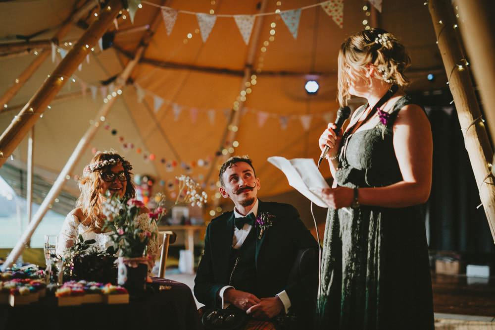 Bride Bridal Lace Sleeves Overlay A Line Dress Gown Flower Crown Kilt Green Jacket Groom Bow Tie Bunting Tipi Ash Farm Barns Wedding Flawless Photography