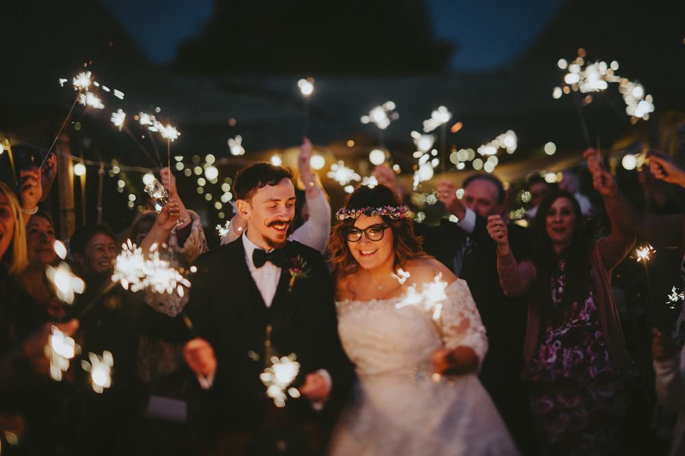 Bride Bridal Lace Sleeves Overlay A Line Dress Gown Flower Crown Kilt Green Jacket Groom Bow Tie Sparkler Send Off Farewell Ash Farm Barns Wedding Flawless Photography