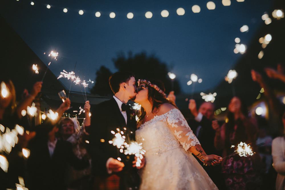 Bride Bridal Lace Sleeves Overlay A Line Dress Gown Flower Crown Kilt Green Jacket Groom Bow Tie Sparkler Send Off Farewell Ash Farm Barns Wedding Flawless Photography