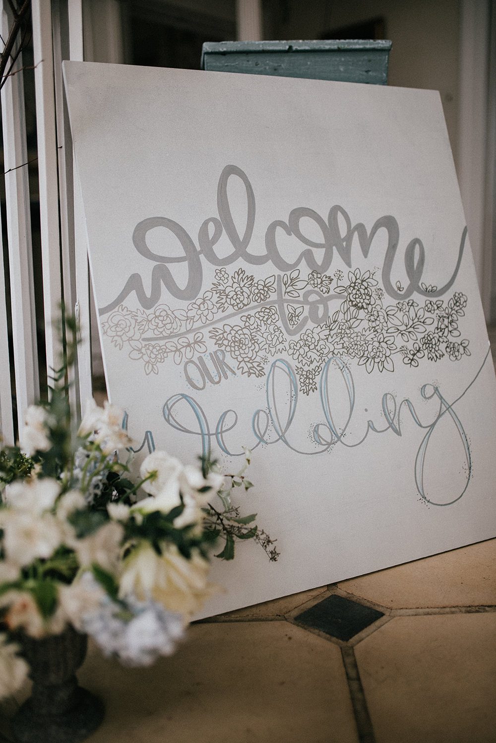Welcome Sign Silver Calligraphy Floral Signage Blue Wedding Ideas Emma McNair Photography