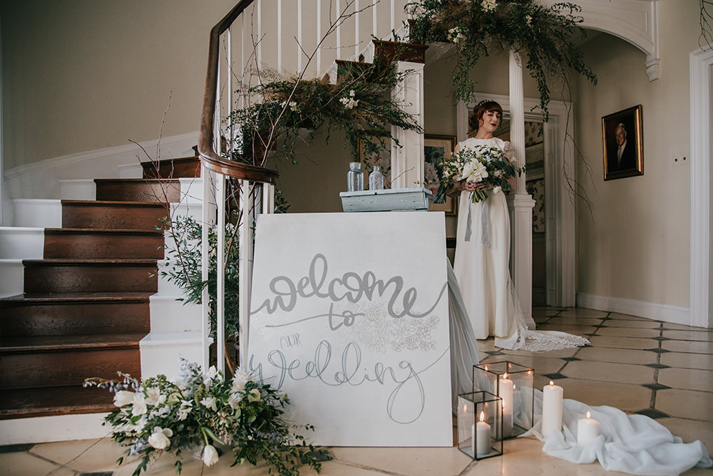 Stairs Staircase Flower Installation Greenery Foliage Arrangement Sign Signage Blue Wedding Ideas Emma McNair Photography