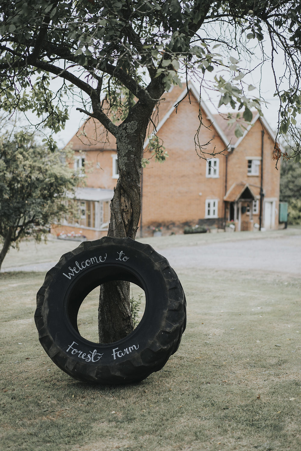 Welcome Sign Tractor Wheel Modern Calligraphy Celestial Cow Shed Wedding Tora Baker Photography