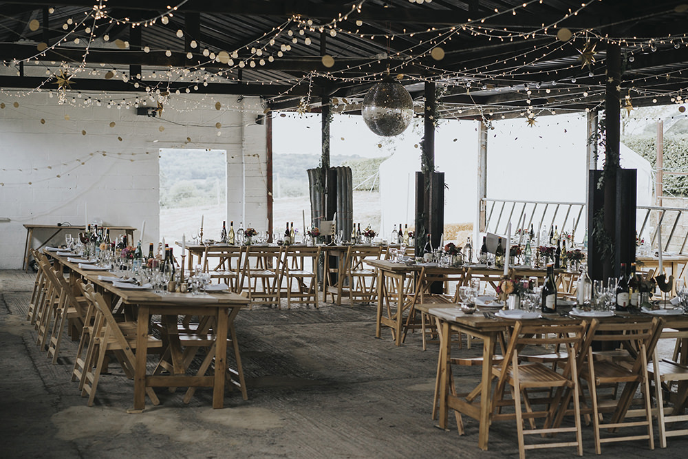 Feasting Table Festoon Lighting Disco Ball Barn Celestial Cow Shed Wedding Tora Baker Photography