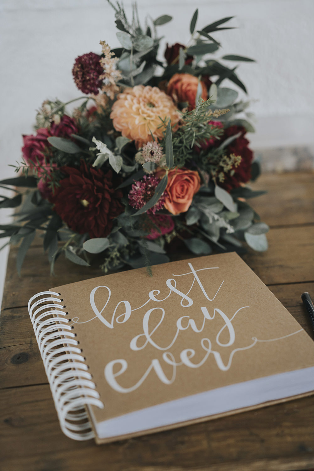 Bride Bridal Bouquet Dahlia Burgundy Coral Rose Eucalyptus Celestial Cow Shed Wedding Tora Baker Photography