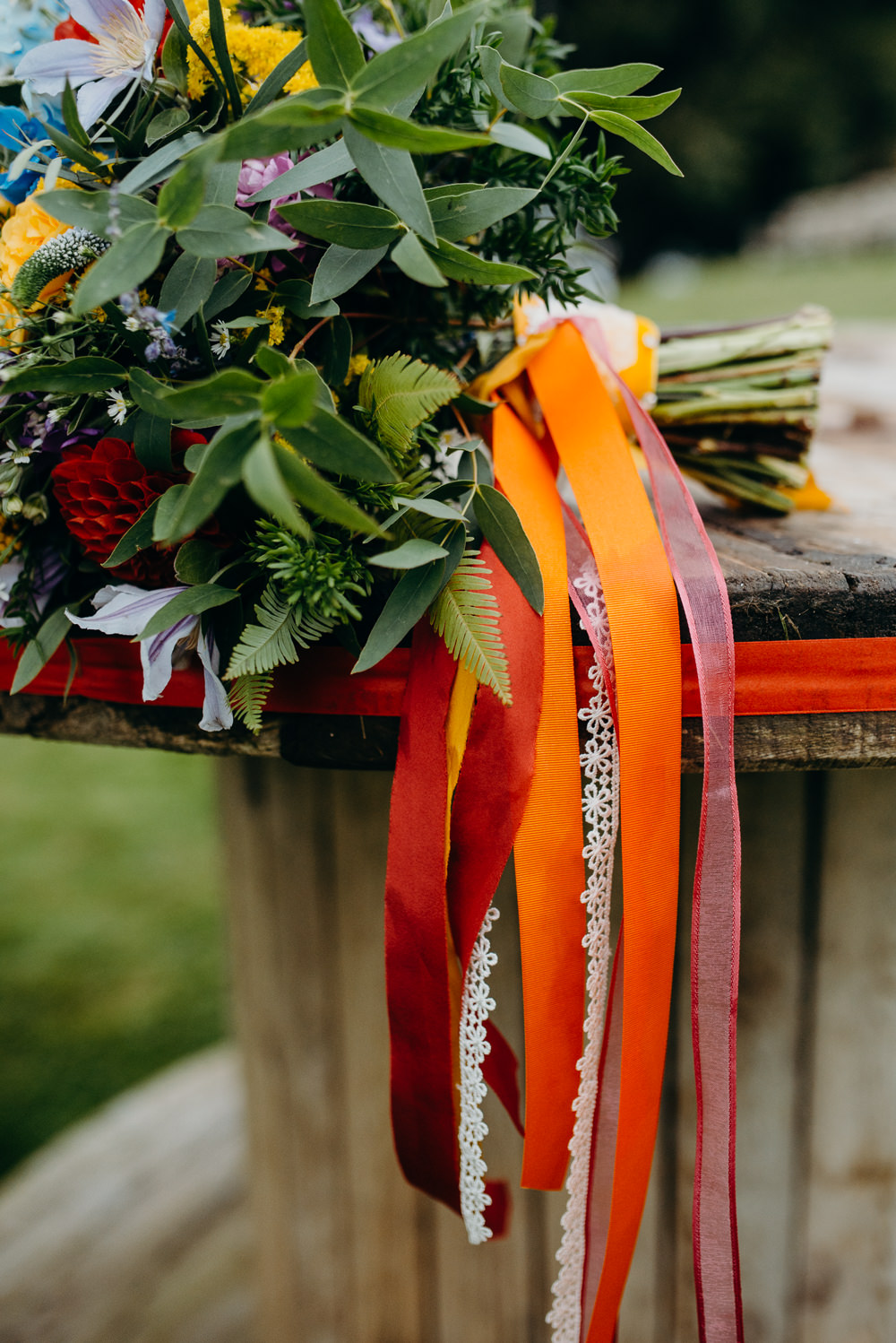 Bouquet Flowers Bride Bridal Rainbow Ribbons Wildflowers Wild Natural Colourful Stretch Tent Wedding Peter Mackey Photography