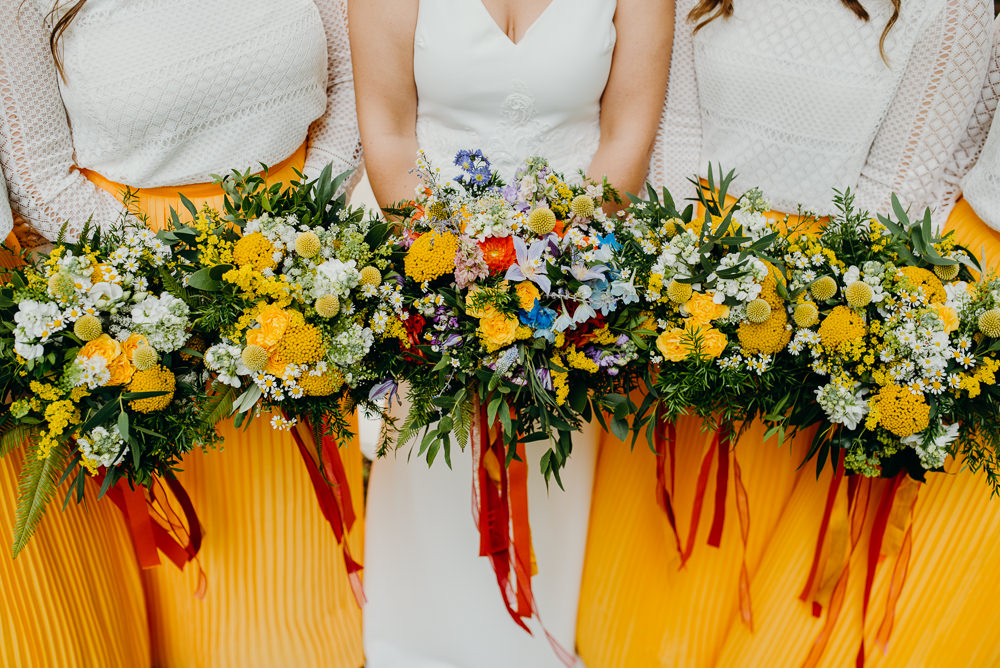 Bouquet Flowers Bride Bridal Rainbow Ribbons Wildflowers Wild Natural Bridesmaids Colourful Stretch Tent Wedding Peter Mackey Photography