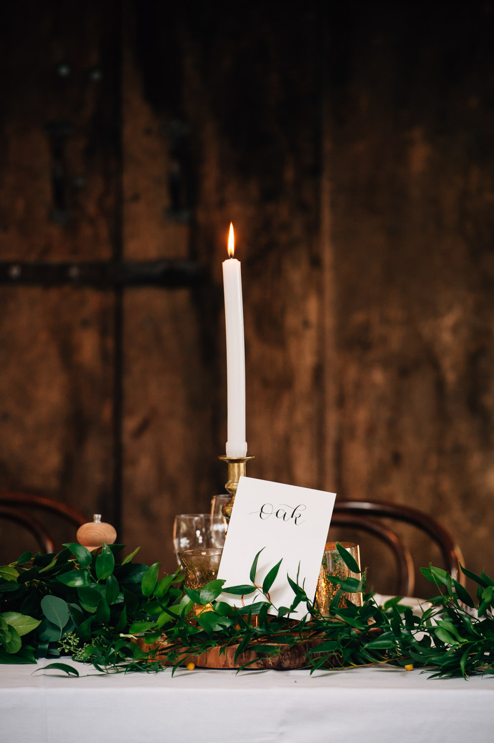 Calligraphy Table Name Candle Greenery Foliage Table Flowers Decor Cripps Barn Wedding Isobel Murphy Photography