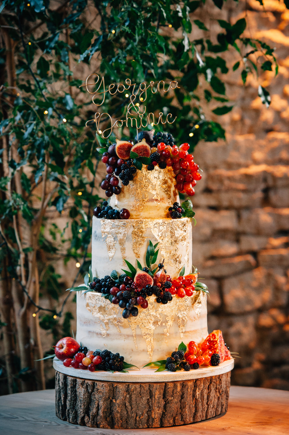 Semi Naked Cake Gold Leaf Berries Log Stand Wire Topper Cripps Barn Wedding Isobel Murphy Photography