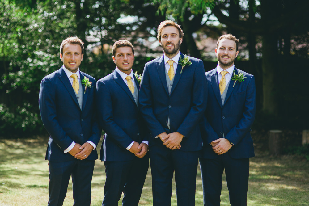 Groom Groomsmen Suits Yellow Tie Navy Waistcoat Damerham Village Hall Wedding Lisa-Marie Halliday Photography