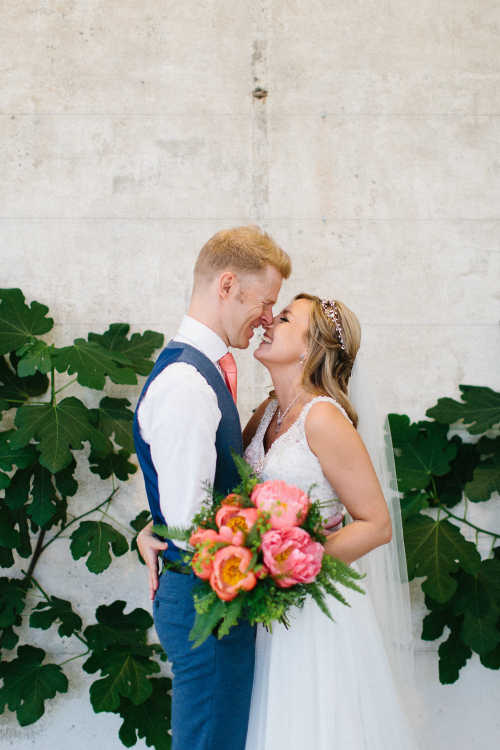 Bride Bridal Dress Sleeveless A Line Beaded Embellished V Neck Tiara Blue Suit Waistcoat Groom Veil Coral Peony Bouquet Garden Ceremony Wedding Melissa Beattie Photography