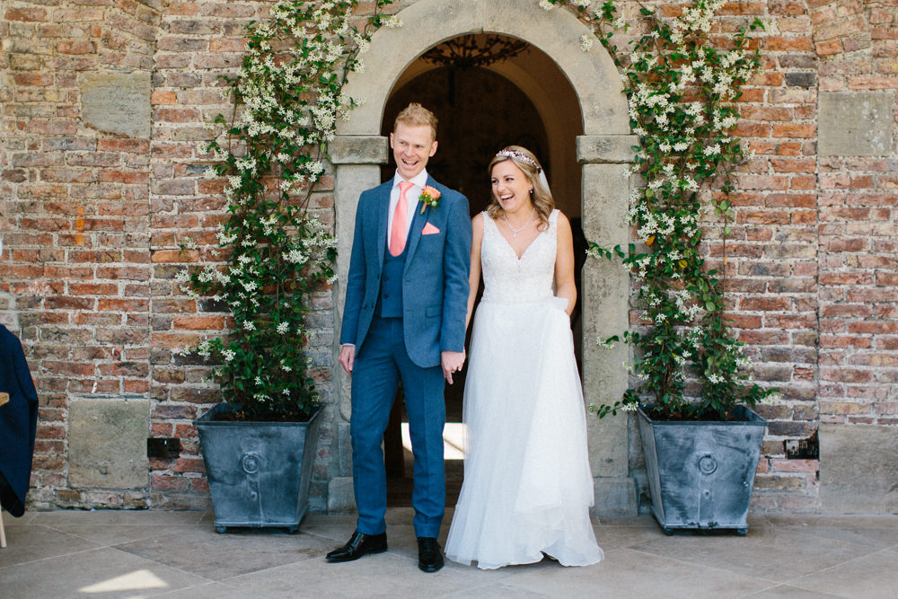 Bride Bridal Dress Sleeveless A Line Beaded Embellished V Neck Tiara Blue Suit Waistcoat Groom Veil Coral Tie Garden Ceremony Wedding Melissa Beattie Photography