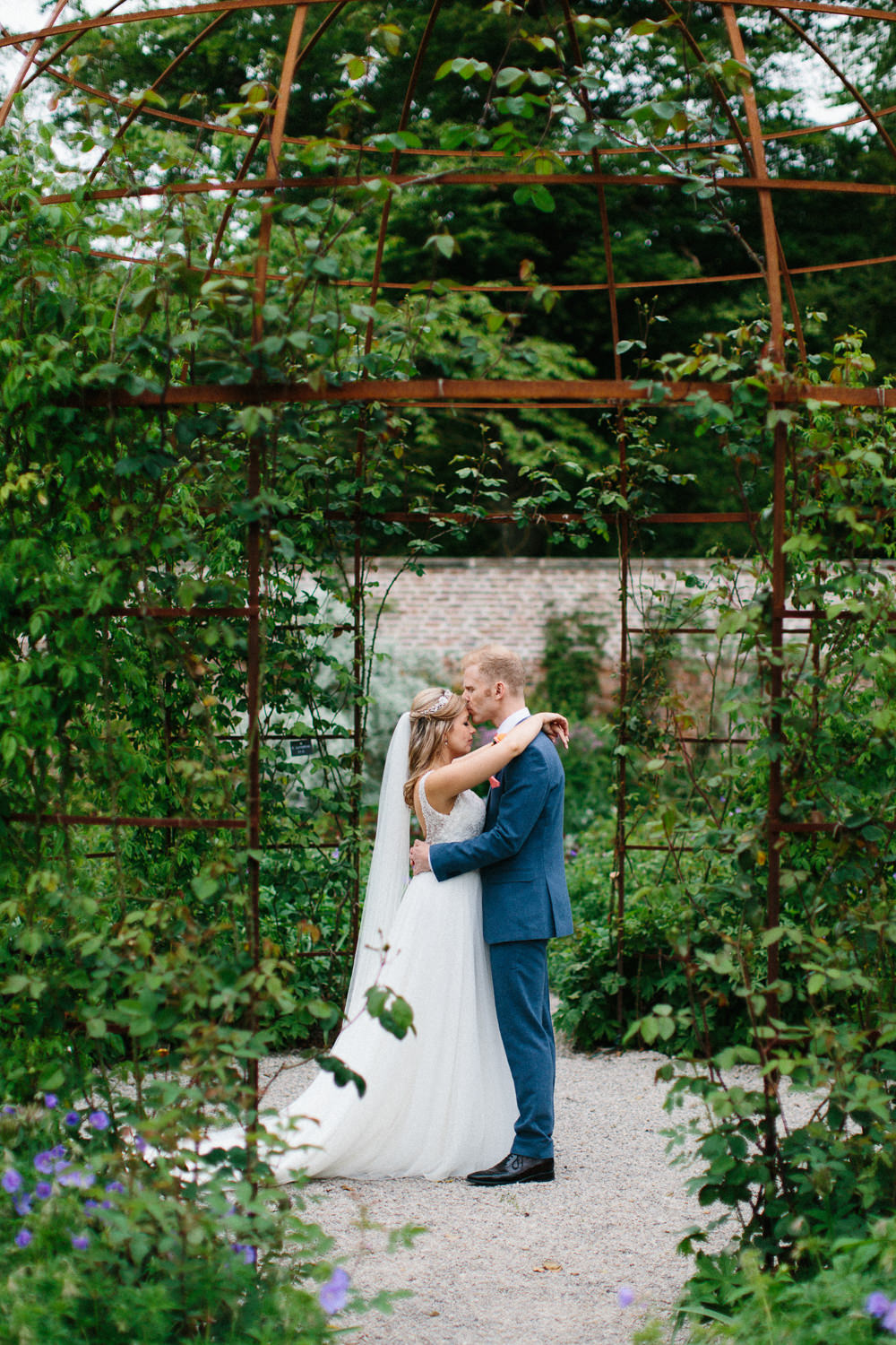 Bride Bridal Dress Sleeveless A Line Beaded Embellished V Neck Tiara Blue Suit Waistcoat Groom Veil Garden Ceremony Wedding Melissa Beattie Photography