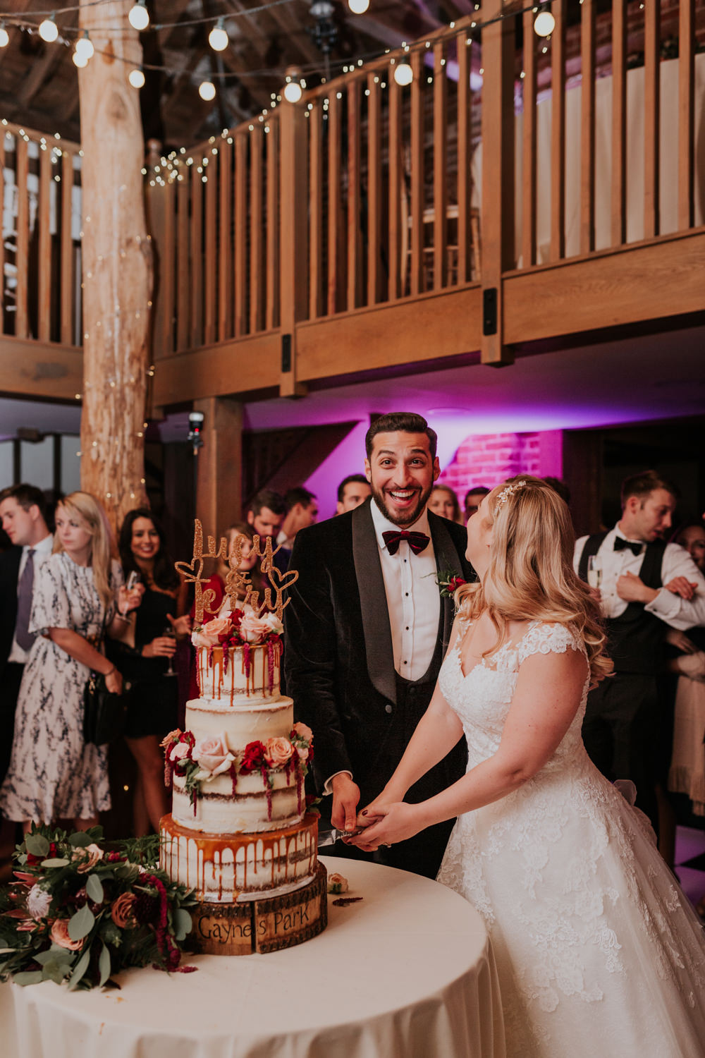 Bride Bridal Cap Sleeve Lace Overlay Dress Gown Velvet Tuxedo Burgundy Bow Tie Groom Drip Cake Cutting Gaynes Park Wedding Kate Gray Photography