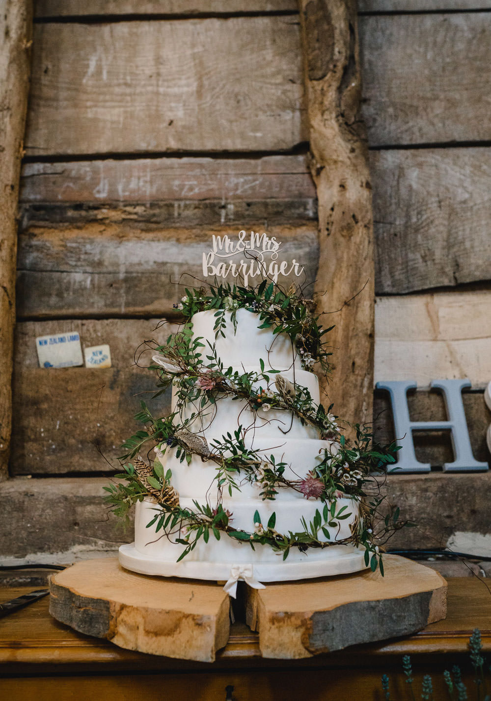 Cake Feathers Greenery Foliage Topper Log Stand Slice Holkham Hall Wedding Luis Holden Photography