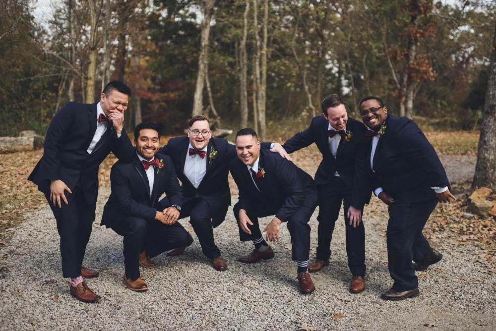 Groom Groomsmen Suit Red Bow Ties Kindred Barn Wedding The Kindred Collective