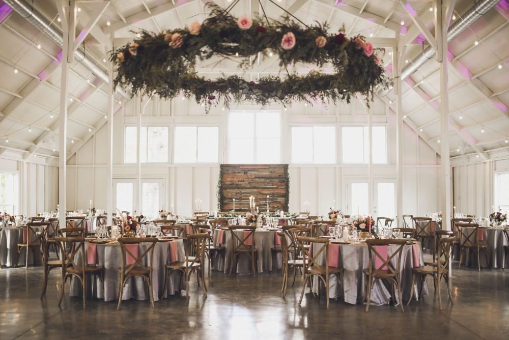 Hanging Suspended Hoop Chandelier Greenery Foliage Installation Decor Kindred Barn Wedding The Kindred Collective