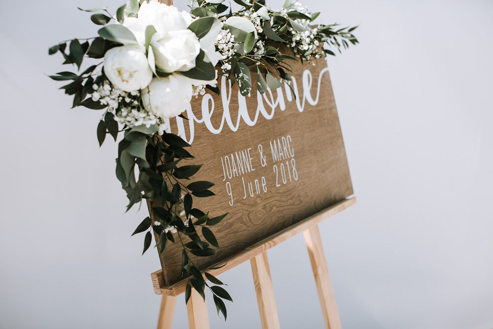 Wooden Welcome Sign Modern Calligraphy Easel Floral Flowers Portugal Destination Wedding Ana Parker Photography