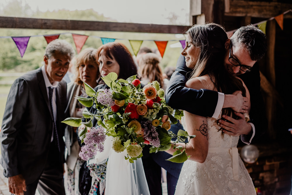 Bouquet Flowers Bride Bridal Greenery Foliage Lilac Ranunculus Rustic Barn Wedding Louise Griffin Photography