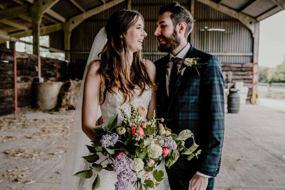 Bouquet Flowers Bride Bridal Greenery Foliage Lilac Ranunculus Rustic Barn Wedding Louise Griffin Photography