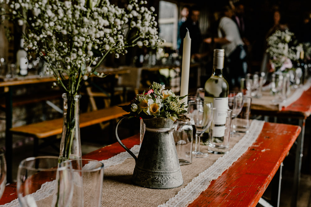 Long Wooden Trestle Tables Jug Flowers Hessian Burlap Rustic Barn Wedding Louise Griffin Photography