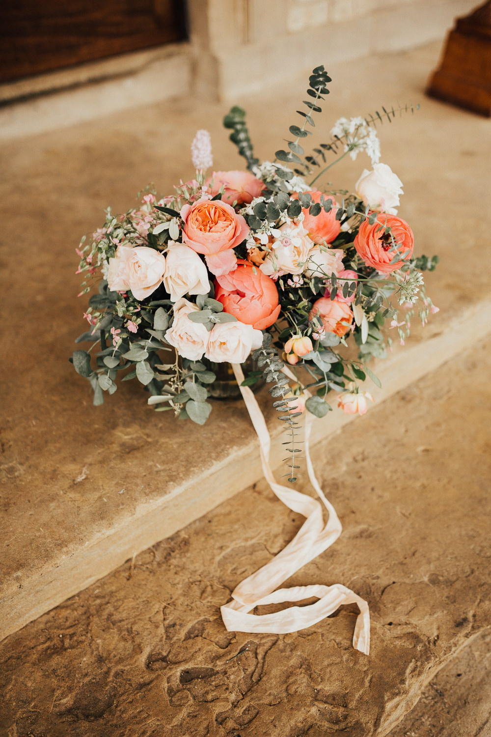 Bride Bridal Bouquet Flowers Coral Peony Peonies Rose Pink Ranunculus Eucalyptus Ribbon Stubton Hall Wedding Darina Stoda Photography