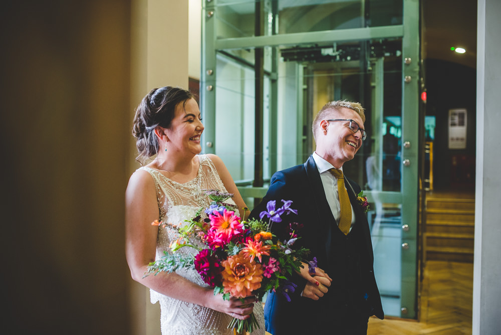 Bride Bridal Beaded Embellished Dress Navy Blue Tuxedo Mustard Tie Groom Multicoloured Bouquet Victoria Gallery Museum Wedding Emma Hillier Photography