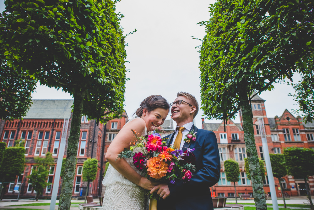 Bride Bridal Beaded Embellished Dress Navy Blue Tuxedo Mustard Tie Groom Multicoloured Bouquet Victoria Gallery Museum Wedding Emma Hillier Photography