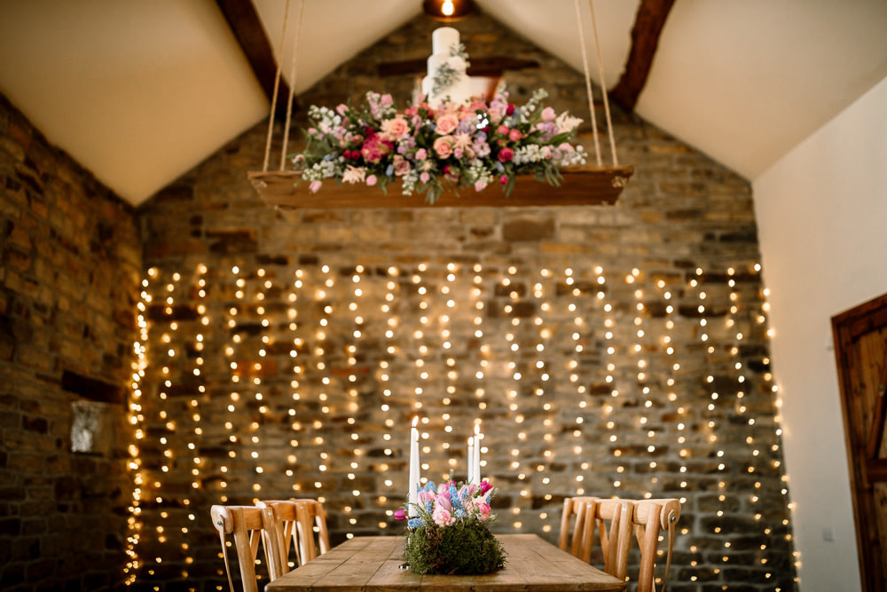 Suspended Hanging Swing Flowers Florals Pink Blue Pretty Cake Table Blossom Barn Wedding Ideas Hayley Baxter Photography