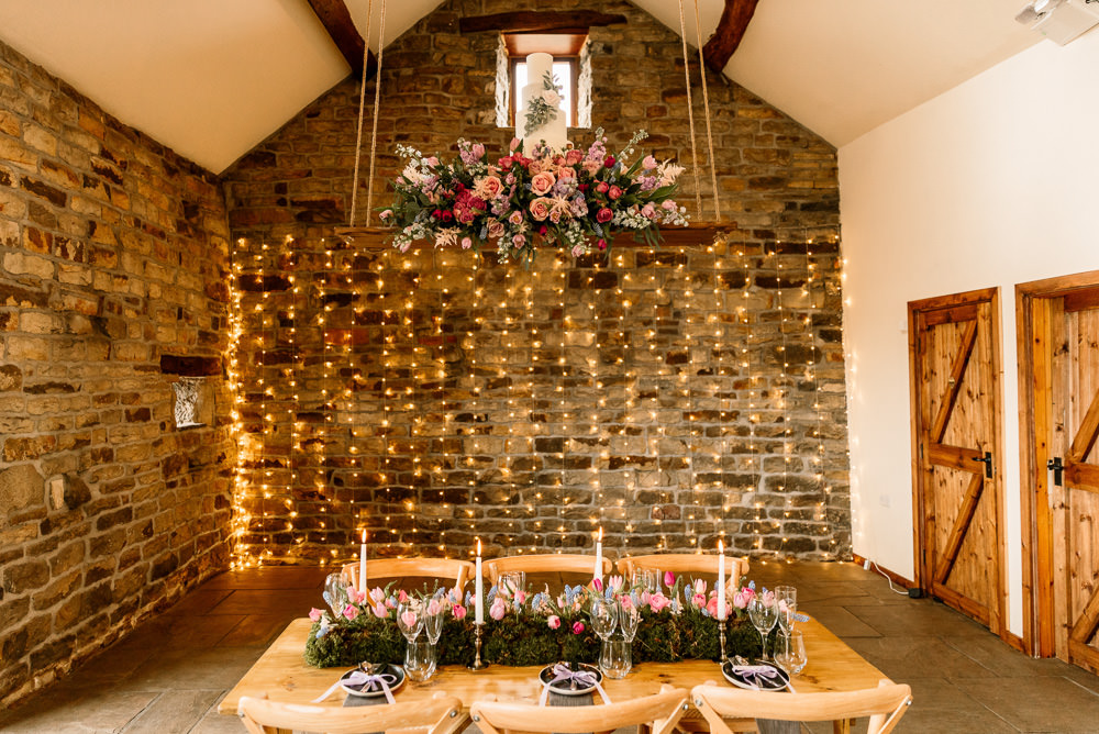Suspended Hanging Swing Flowers Florals Pink Blue Pretty Tablescape Decor Blossom Barn Wedding Ideas Hayley Baxter Photography