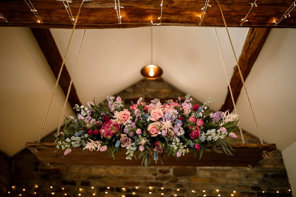 Suspended Hanging Swing Flowers Florals Pink Blue Pretty Blossom Barn Wedding Ideas Hayley Baxter Photography